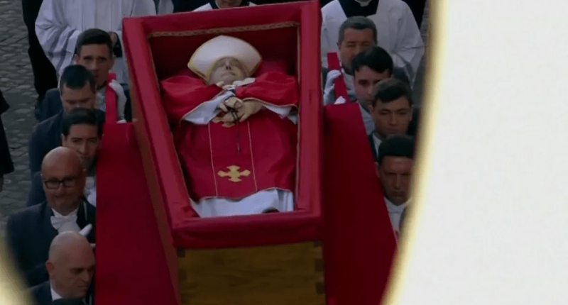 Pallbearers carrying the Pope's coffin.