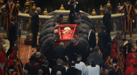 Pallbearers carrying a Pope's coffin.