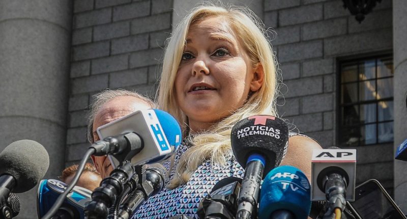 FILE - Virginia Roberts Giuffre holds a news conference outside a Manhattan court following the jailhouse death of Jeffrey Epstein, Aug. 27, 2019, in New York. A tentative settlement has been reached in a lawsuit accusing Prince Andrew of sexually abusing a 17-year-old American, according to a court filing Tuesday, Feb. 15, 2022. (AP Photo/Bebeto Matthews, File)