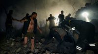 Rescuers and civilians searching for victims in the rubble of a destroyed building.