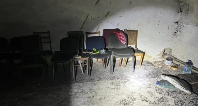 Alleged torture chamber in Kherson with chairs and debris on the floor.