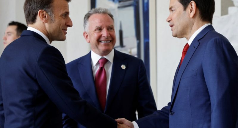 Emmanuel Macron shaking hands with Steve Witkoff and Marco Rubio at the Elysee Palace.