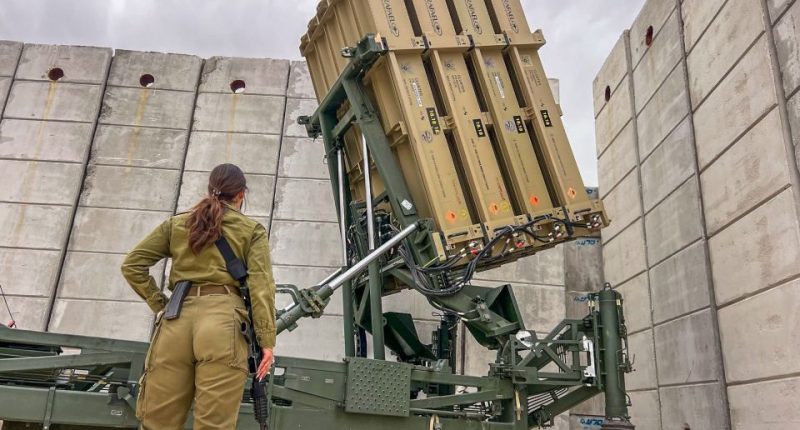 Iron Dome operator with missile launcher.