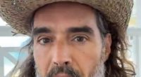 Close-up of a man with long hair and a beard wearing a straw hat, speaking.