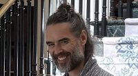 Russell Brand seen for first time after being charged with rape