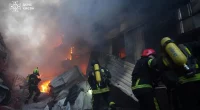 Russian air strikes kill 1 in Kyiv as Zelenskyy demands more pressure on Putin