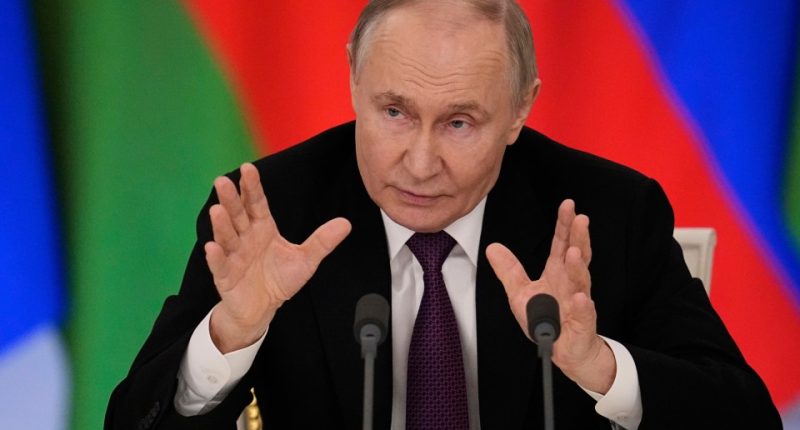 Vladimir Putin speaking at a press conference.