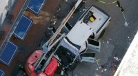 Aerial view of a damaged truck at the scene of an accident.
