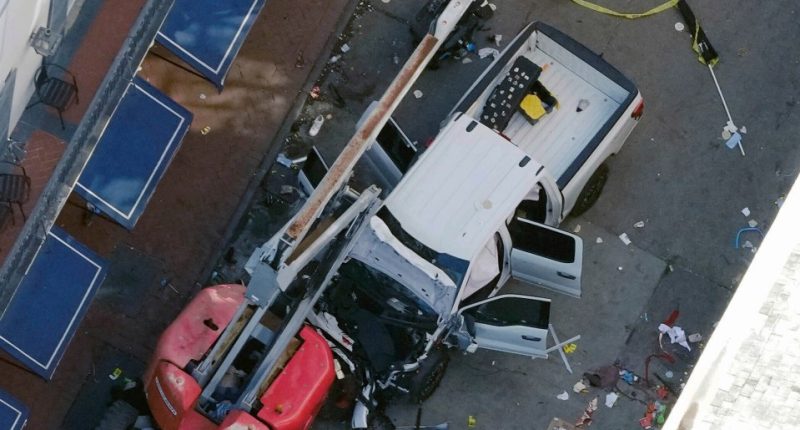 Aerial view of a damaged truck at the scene of an accident.