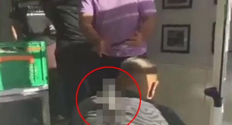 A stabbed man crawls on the floor.