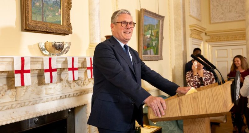 Prime Minister speaking at a podium.