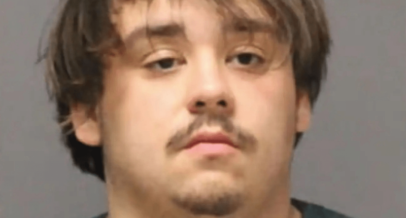 Mugshot of a young man with brown hair.
