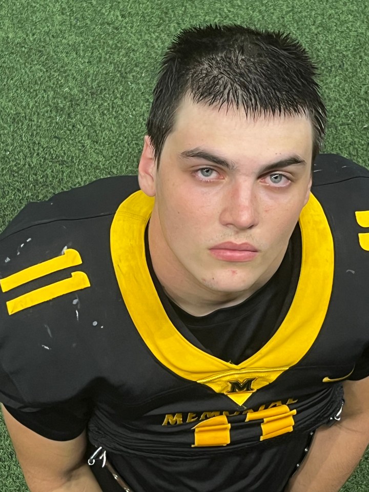 Portrait of Austin Metcalf in a football jersey.