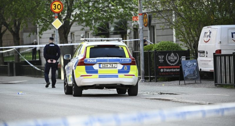 Police car at a crime scene.