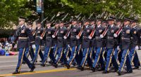 US Army honor guard marching in a parade.
