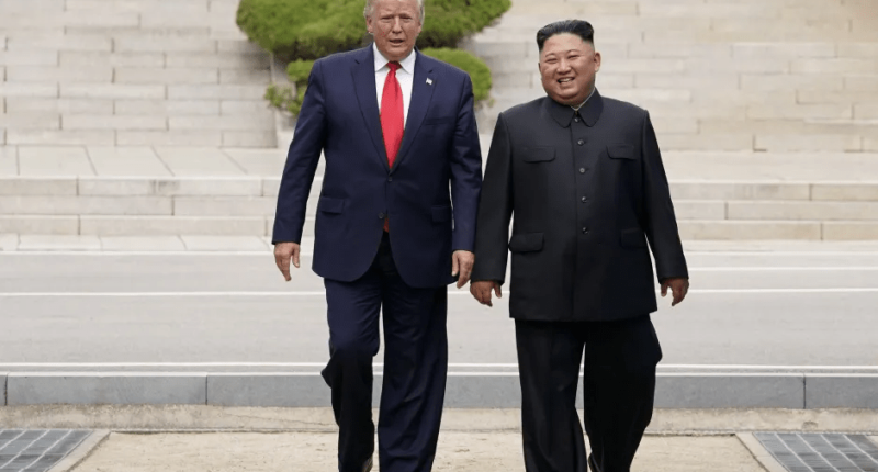 Donald Trump and Kim Jong Un walking together.
