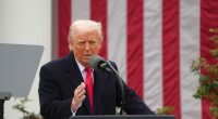 Donald Trump speaking at a podium.