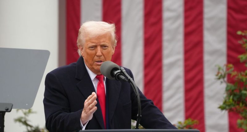 Donald Trump speaking at a podium.