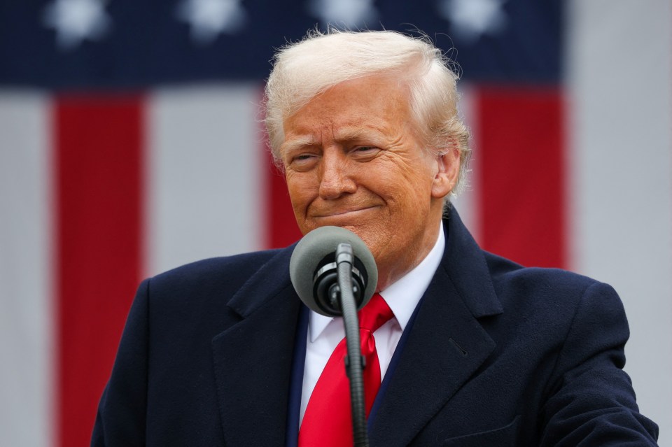 Donald Trump speaking at a microphone.