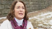 Woman being interviewed outdoors about a UPS package delivery scam.
