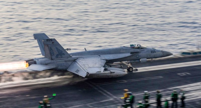 US Navy F/A-18 Super Hornet launching from aircraft carrier.