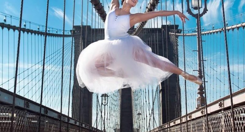 Ballet dancer leaping on a bridge.
