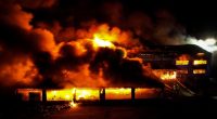 Drone view of a burning household goods warehouse in Mykolaiv, Ukraine.