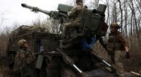 Ukrainian National Guard soldiers preparing to fire a Bohdana self-propelled howitzer.