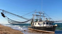 Unmanned shrimp boat washes ashore on Florida beach, puzzling investigators