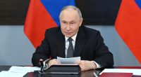 Vladimir Putin chairing a meeting on navy development.