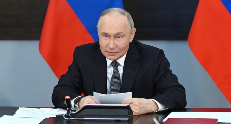 Vladimir Putin chairing a meeting on navy development.