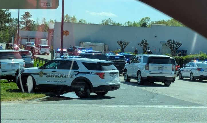 Police cars outside a Walmart.