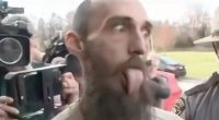 Arson suspect Cody Balmer sticking his tongue out during his arraignment.