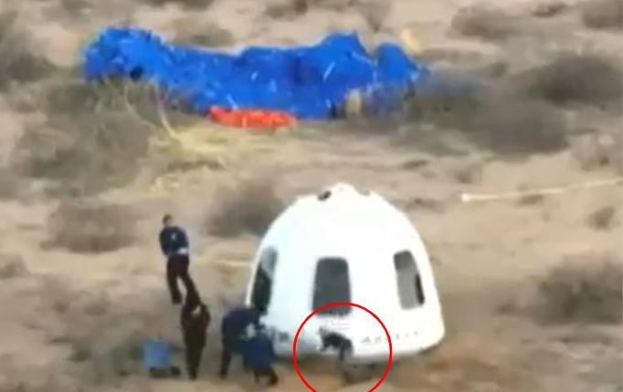Crew recovering SpaceX Dragon capsule after landing.