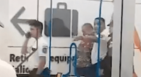Security personnel detaining a person at an airport.