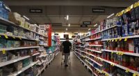 A shopper moves along a grocery aisle at a inner-city grocery store on March 25, 2025 in Sydney, Australia.