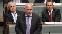 Malcolm Turnbull and Tony Abbott look on as Petro Georgiou delivers his final speech