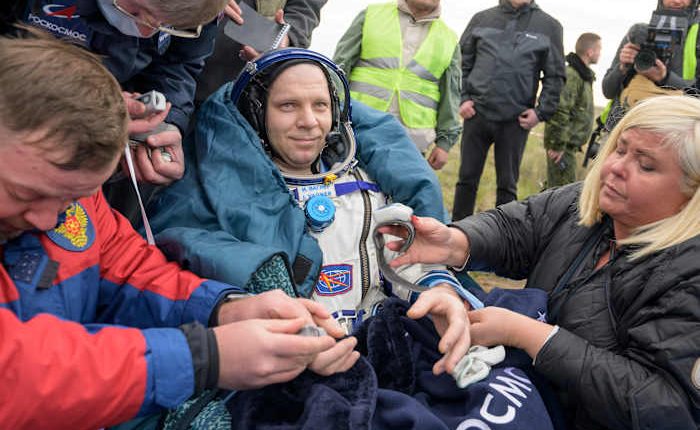 A Soyuz capsule with 2 Russians and 1 American returns to Earth from the International Space Station