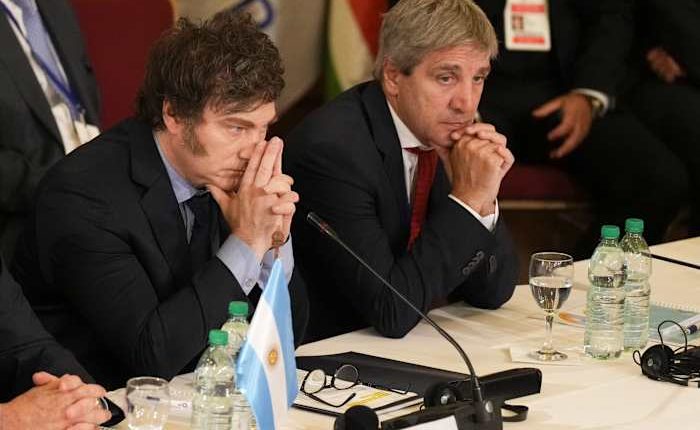 Argentina says it will lift the country's strict currency controls with help from the IMF