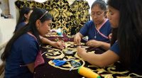Artisans in Guatemala hand-stitch velvet cloaks for Holy Week processions