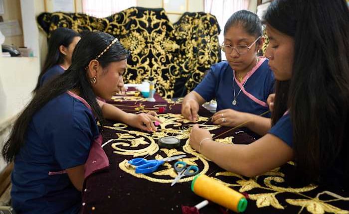 Artisans in Guatemala hand-stitch velvet cloaks for Holy Week processions