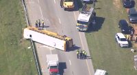 At least 1 dead after school bus overturns on Interstate 77 in Chester County, South Carolina, officials say