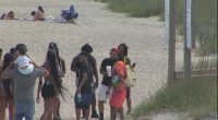 Attendees make their way onto Tybee for Orange Crush