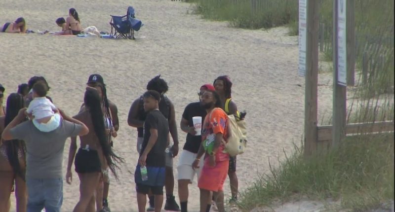 Attendees make their way onto Tybee for Orange Crush