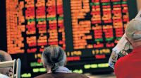 An ASX board showing red losses