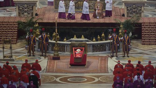 The body of Pope Francis lies inside St. Peter's Basilica at the Vatican, Wednesday, April 23, 2025, where he will lie in state for three days. (AP Photo/Andrew Medichini, Pool)