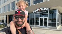 Father and daughter share restaurant reviews online while making memories