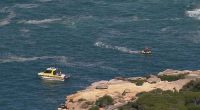 A fisherman has died and a teenager was been rushed to hospital after being washed off rocks in Sydney's south on Easter Sunday.The pair were swept into the water at Wattamolla, in the Royal National Park around 11am, in what is the sixth drowning death this Easter.