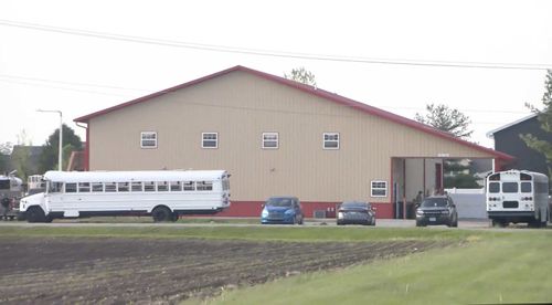This image taken from video provided by WCIA shows first responders working the scene after a car smashed through a building during an after-school program, killing multiple people Monday, April 28, 2025, in Chatham, Ill.
