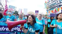 A childcare worker rally for better pay